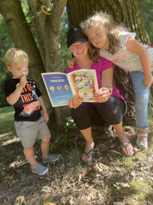 parent and kids reading book