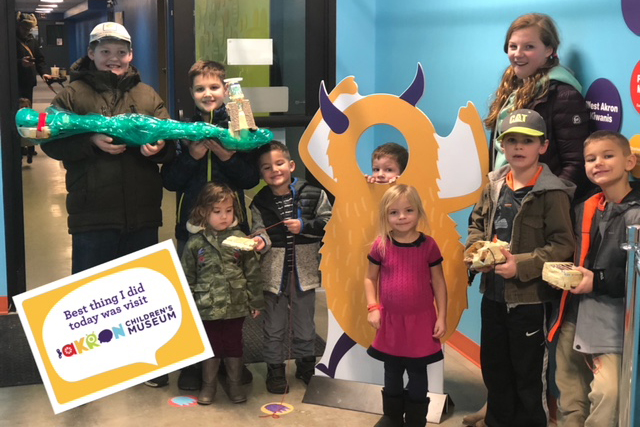 Some families posing by the entrance to the museum