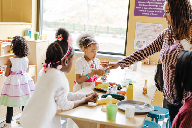Children playing in the kitchen area.