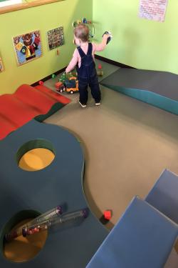 A child playing in the baby area