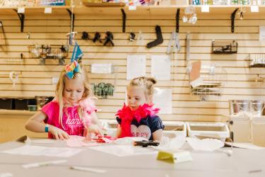Children building on a table in the maker space