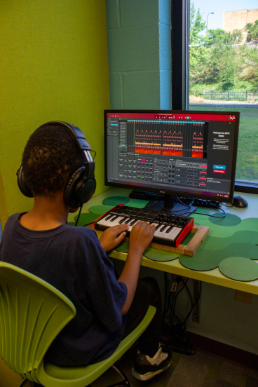 Child on Computer in Sound Studio
